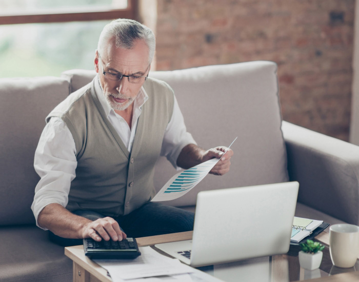 couple looking at laptop and smiling for some reason