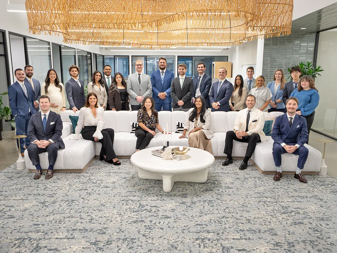 Group photo on couch where you can see ALLLLLL the room