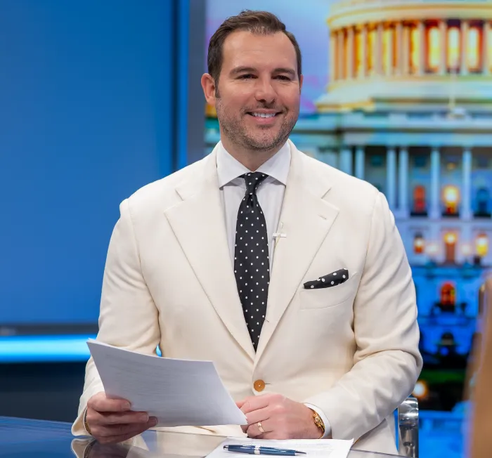 Abe Abich at Newsdesk in White Blazer